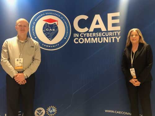 Dr. Kembley Lingelbach and Dr. Kevin Floyd attend the annual 2024 CAE in Cybersecurity Symposium.